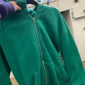 green zip up